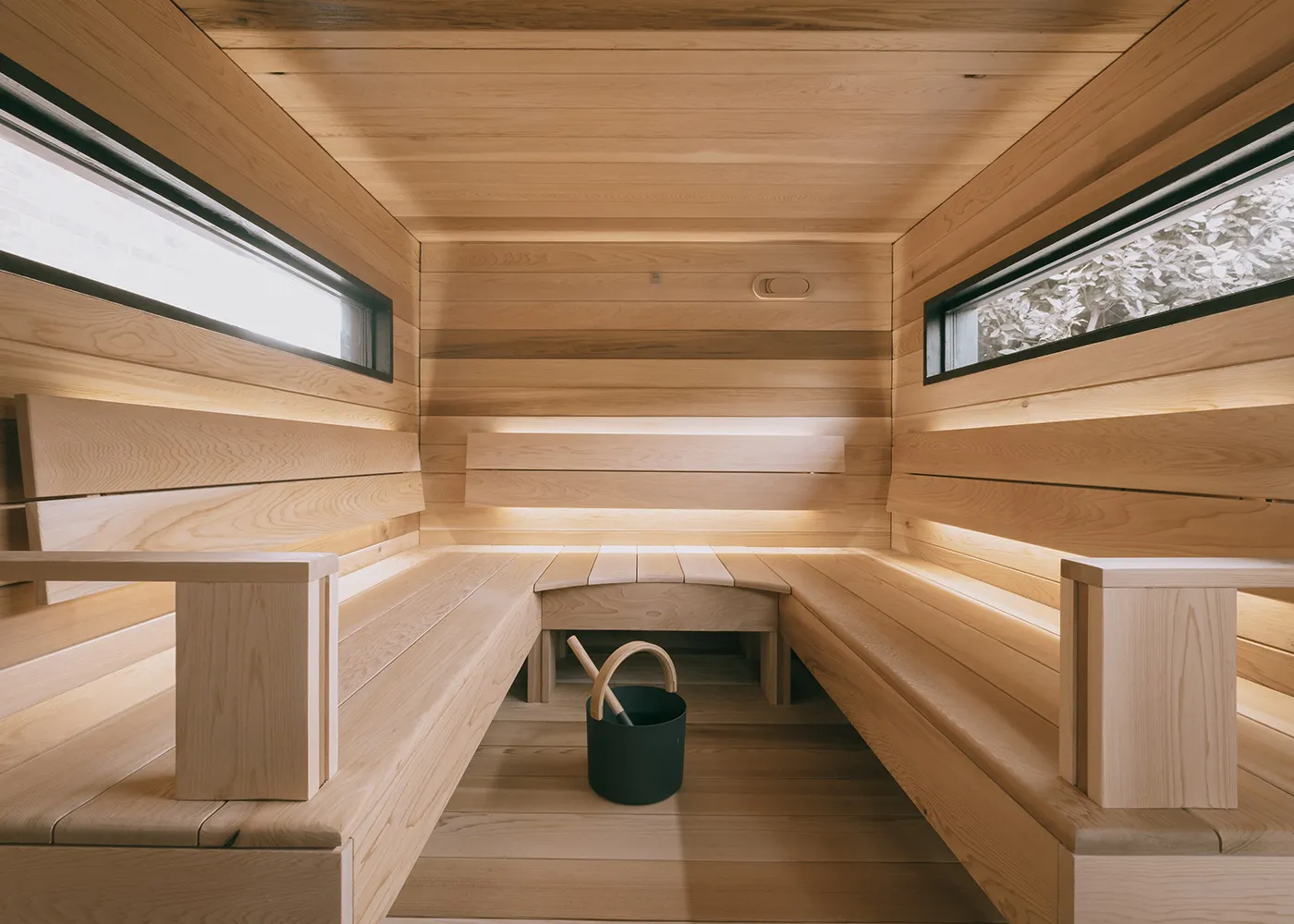 Wide View of a Wildhut Sauna Interior with Cedar Benches and Windows Wide view of a Wildhut sauna interior with cedar benches and windows
